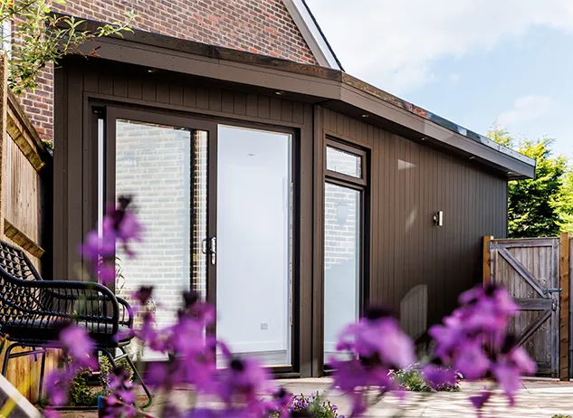 Angled Garden Room with Garage Door