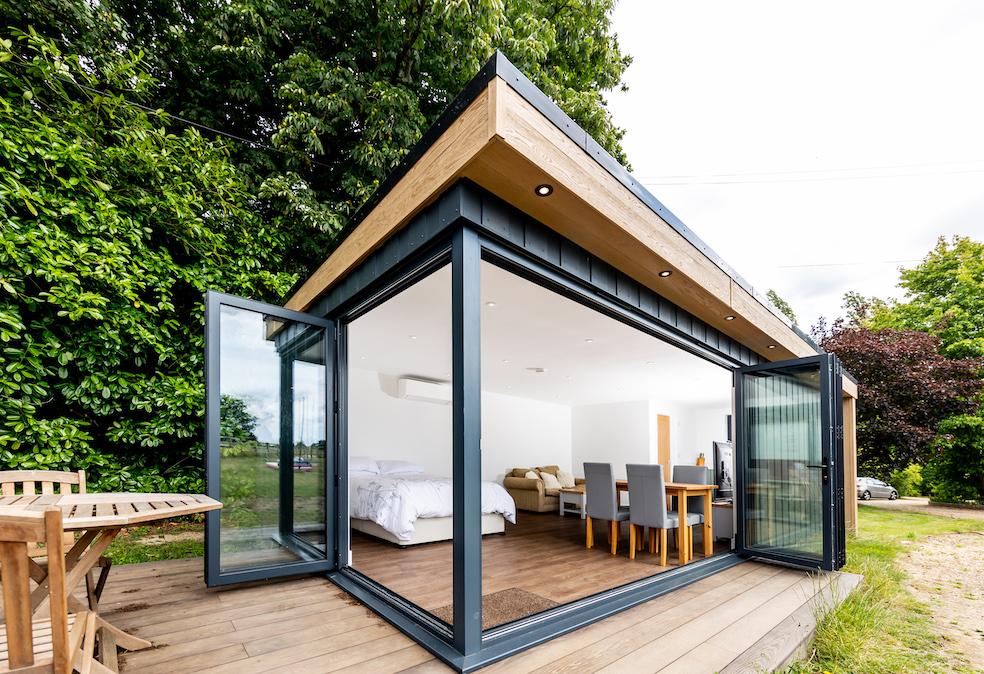 Garden granny annexe in Cranleigh, Surrey, with composite cladding and corner bi-fold doors