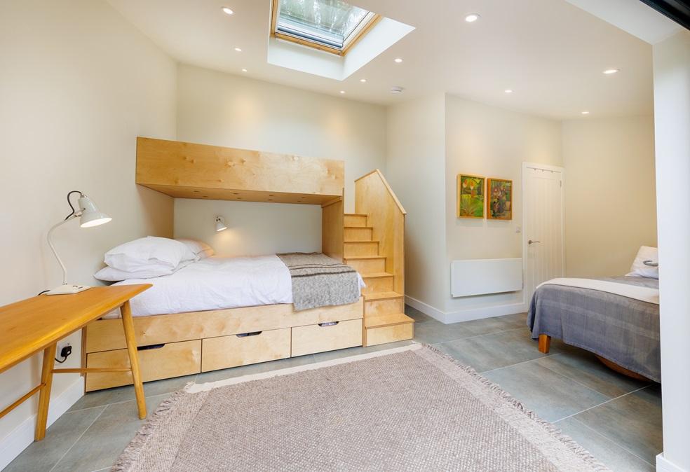 Interior of the Worthing annexe showing the bespoke birch ply bunk bed
